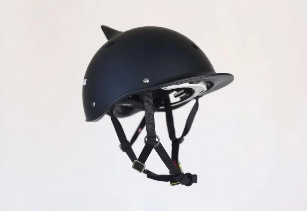 Equestrian helmet with adjustable straps