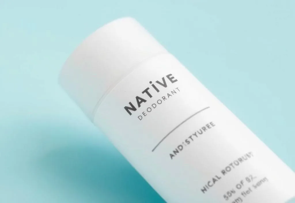 A close-up shot of a Native Deodorant stick with a clean and modern design